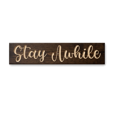 Stay Awhile sign carved into solid wood in a Dark Walnut stain, straight on, on a white background