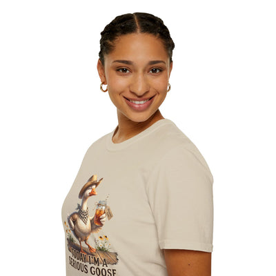 Profile of a smiling woman, showing the side of the beige "Sweet Tea Shirt - Today I'm a Serious Goose" tee