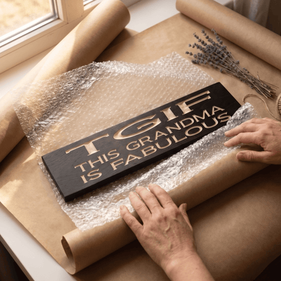 TGIF This Grandma Is Fabulous CNC-carved wood sign in ebony finish being hand-wrapped for shipping at Bluegrass Gifts workshop in Kentucky
