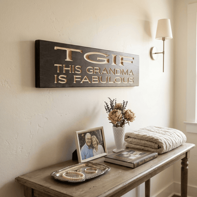 TGIF This Grandma Is Fabulous wood sign hanging in a cozy entryway above a console table with family photo, flowers, and folded throw