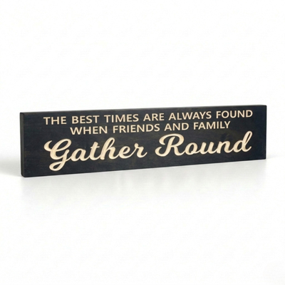 Angled view of "The Best Times Are Always Found When Friends and Family Gather Round" CNC-carved wood sign in Ebony finish.