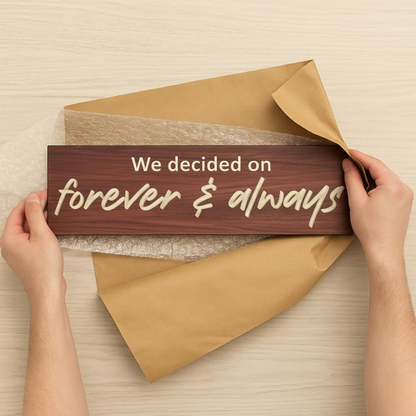 Hands unwrapping handmade “Forever & Always” carved wood sign gift