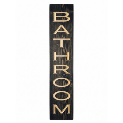 Vertical wooden bathroom sign with deeply CNC carved BATHROOM lettering on solid pine in ebony stain — handcrafted farmhouse bathroom wall decor from Bluegrass Gifts.