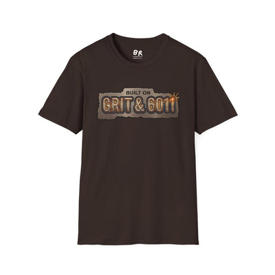 A brown Welding Shirt - Built on Grit & 6011 is presented flat on a white background, showing the front design