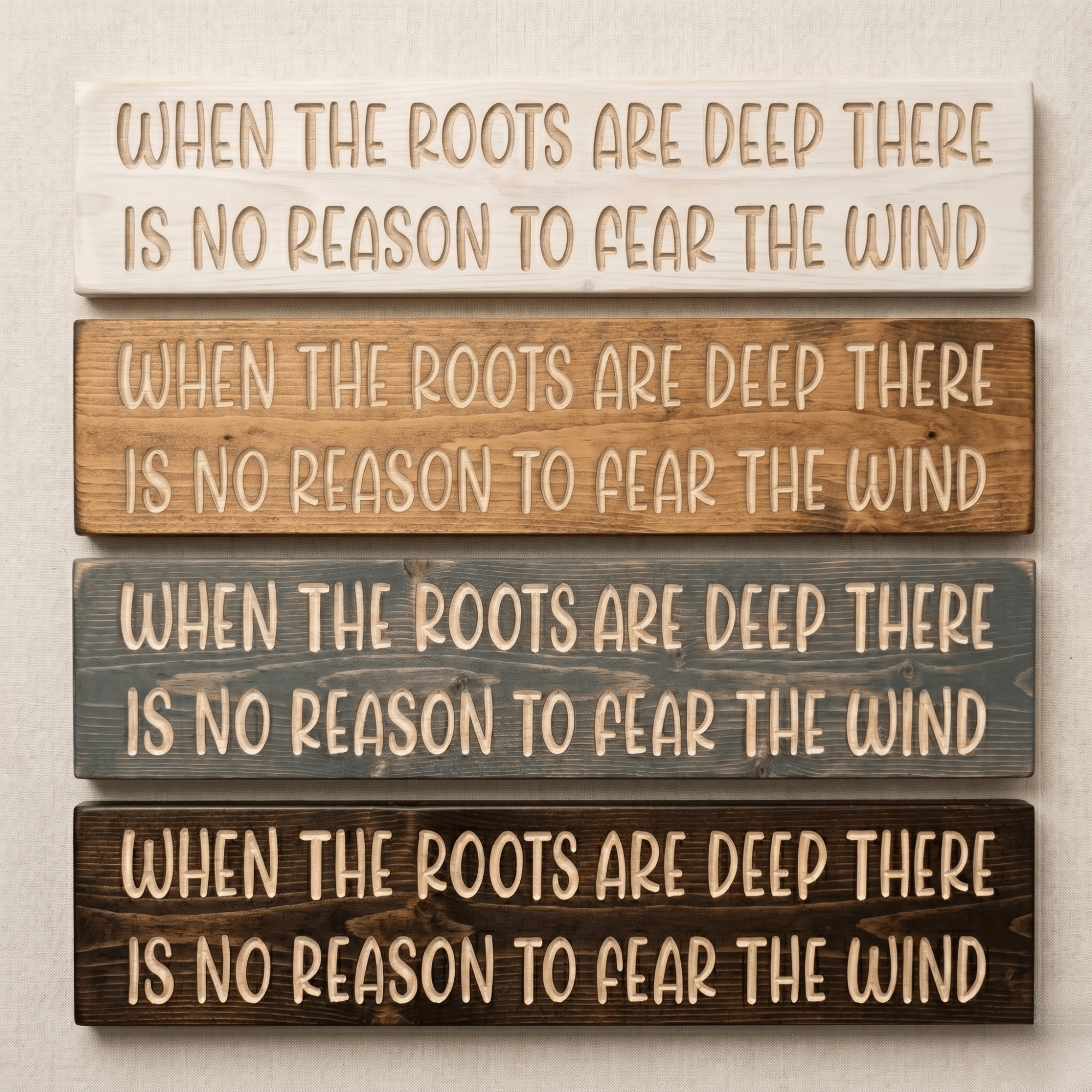 Four finish options for the When the Roots Are Deep inspirational wood sign — white wash, golden mahogany, weathered gray, and dark walnut stains