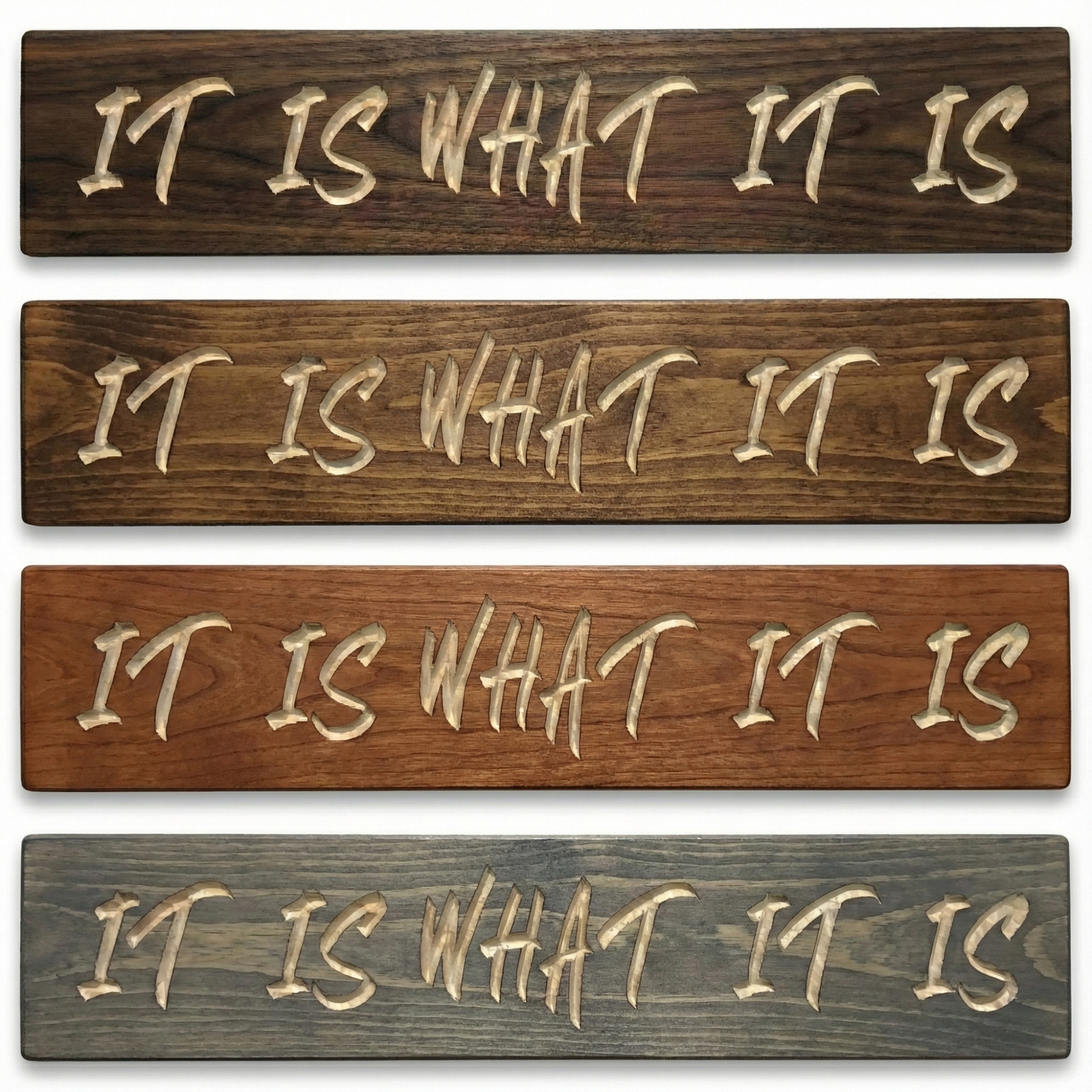 Stack of four carved IT IS WHAT IT IS wood signs showing different finish options including walnut, dark roast, cherry, and weathered gray.