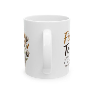 A white ceramic Definition Mug, shown from the side with the handle prominent and a partial view of the "Fixin' To" design