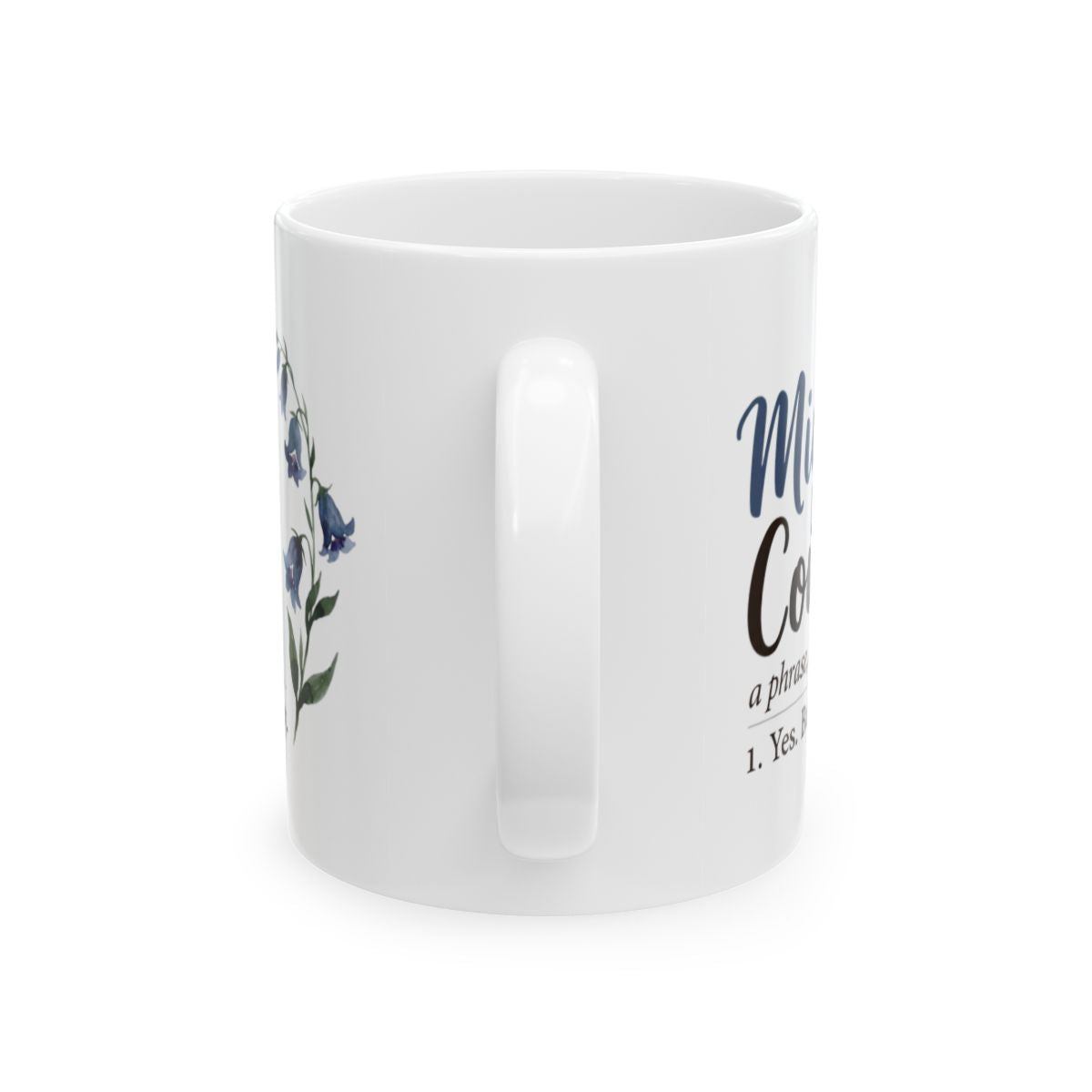 The handle of the white Mug With Sayings is prominent, with the "Might Could" design partially visible on the right side
