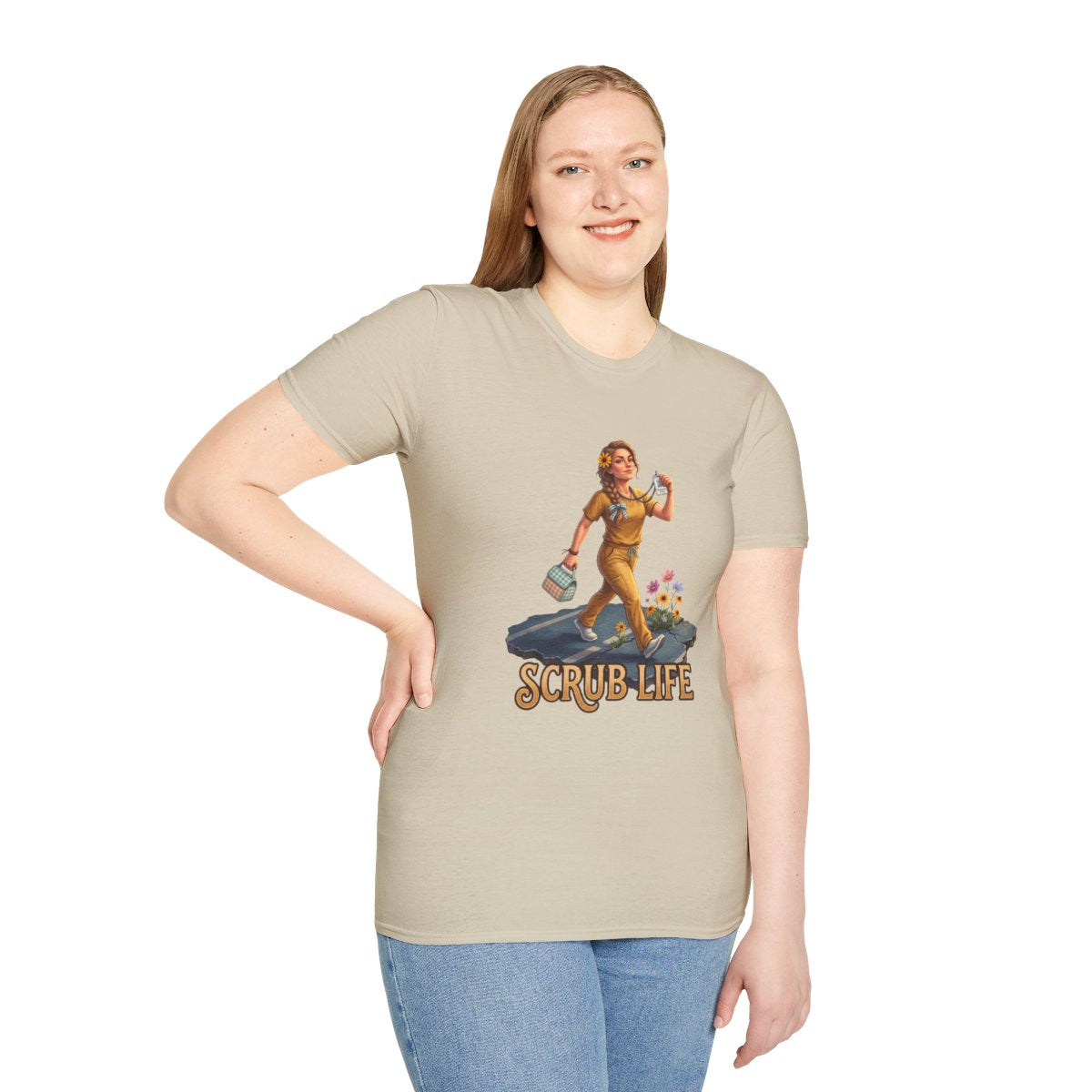 A woman stands with her hand on her hip, modeling the beige "Nurse Shirt - Scrub Life" tee in a studio setting