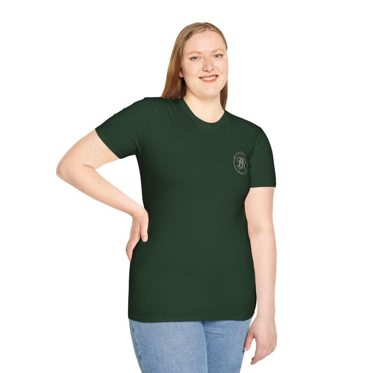 Woman smiling, standing and modeling a dark green t-shirt with a small Bluegrass Roots BR logo on the chest, a fresh look for Punchy Shirts