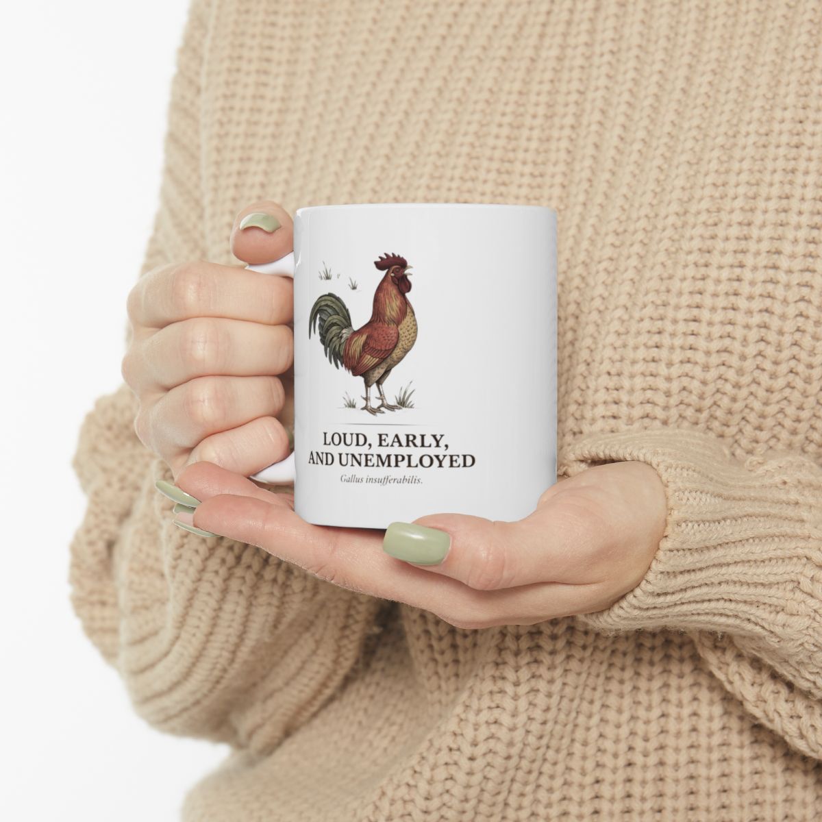 A person in a light-colored sweater holds the Rooster Coffee Mug with both hands, showing the rooster design clearly