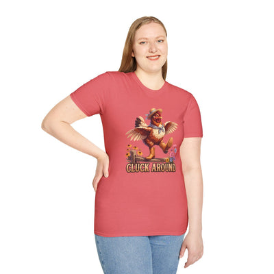 Woman in a coral Chicken Shirt - Cluck Around tee, standing and smiling, with the full chicken graphic visible
