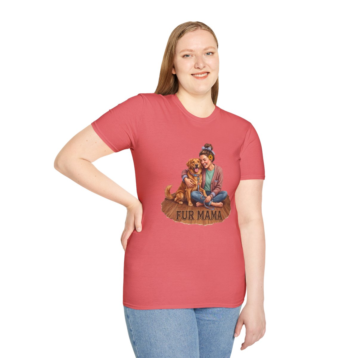 A woman stands front-facing, wearing a coral pink Dog Mom Shirt - Fur Mama, with the graphic of a woman hugging a golden retriever