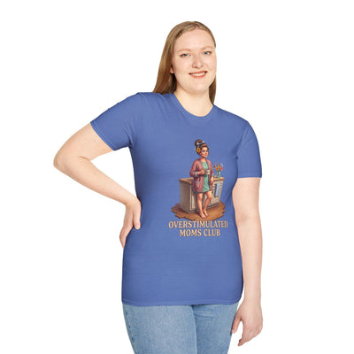 A woman with long hair stands, posing in a blue t-shirt with the "Overstimulated Shirt - Overstimulated Moms Club" graphic, front view