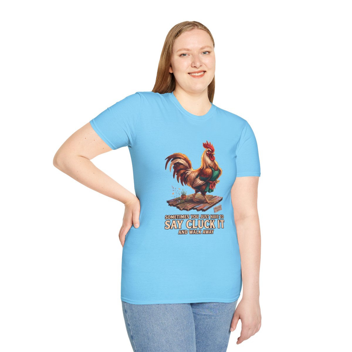 A woman stands facing forward, wearing a light blue Chicken Shirt - Sometimes You Just Have to Say Cluck It, with jeans
