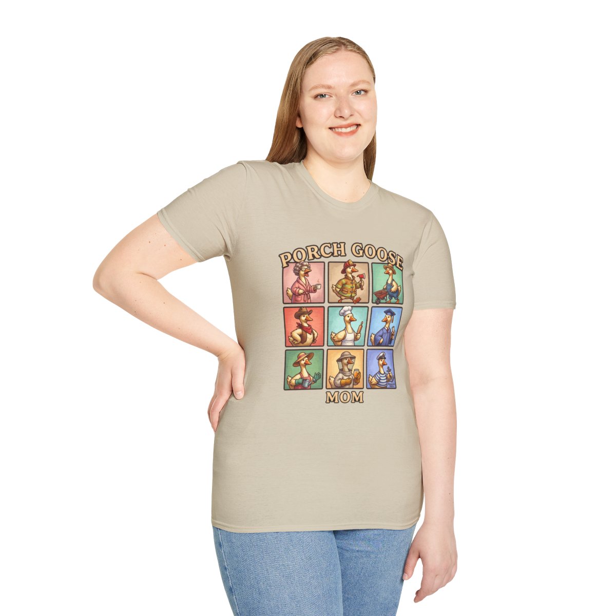 A woman with light brown hair smiles while modeling the beige Funny Goose Shirt - Porch Goose Mom, standing with a hand on her hip