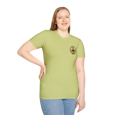 Front view of a woman smiling, wearing a light green Raised Right Shirt with the small chest logo visible
