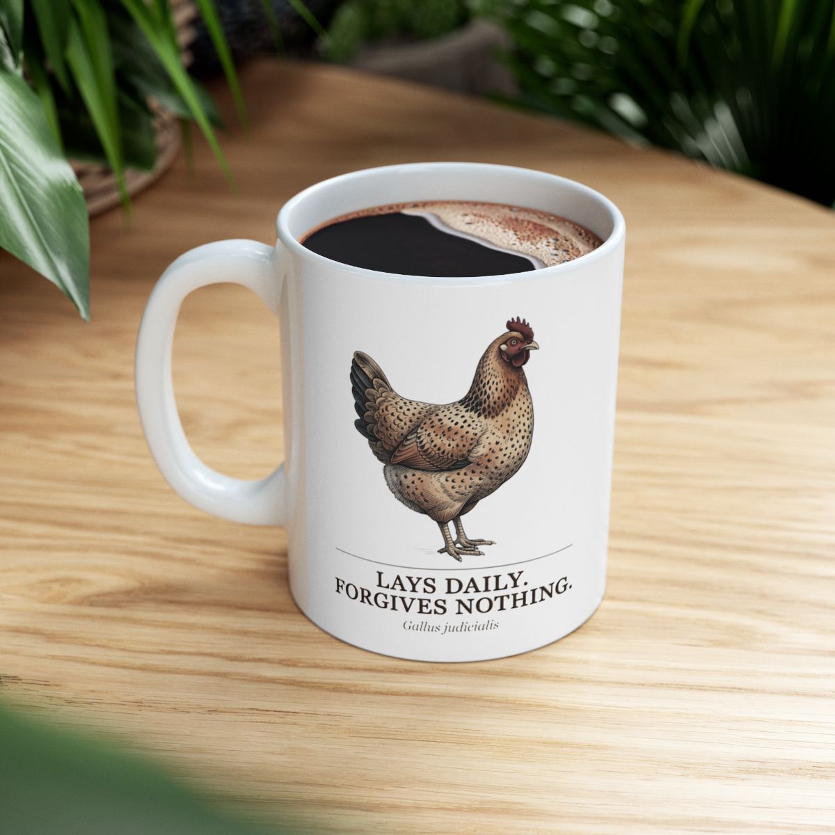 A full Chicken Coffee Mug with dark liquid, sitting on a wooden table with a green plant in the background