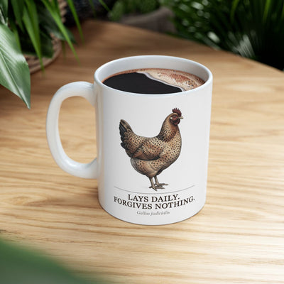 A full Chicken Coffee Mug with dark liquid, sitting on a wooden table with a green plant in the background