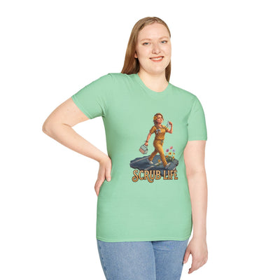 A smiling woman with light brown hair models a light mint green "Nurse Shirt - Scrub Life" tee on a white background, left hand on hip
