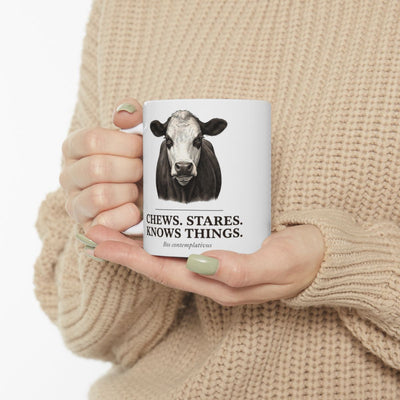 Cow Coffee Mug — "Chews. Stares. Knows Things." Vintage Engraved Black Baldy Mug