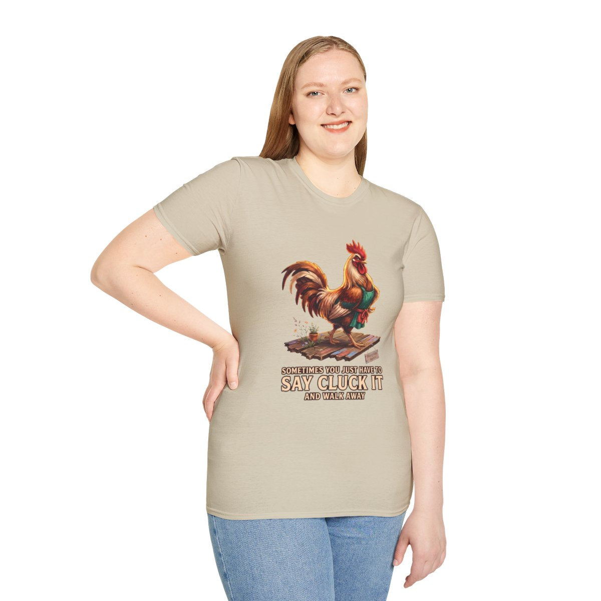 A woman smiles facing forward, wearing a light tan Chicken Shirt - Sometimes You Just Have to Say Cluck It,