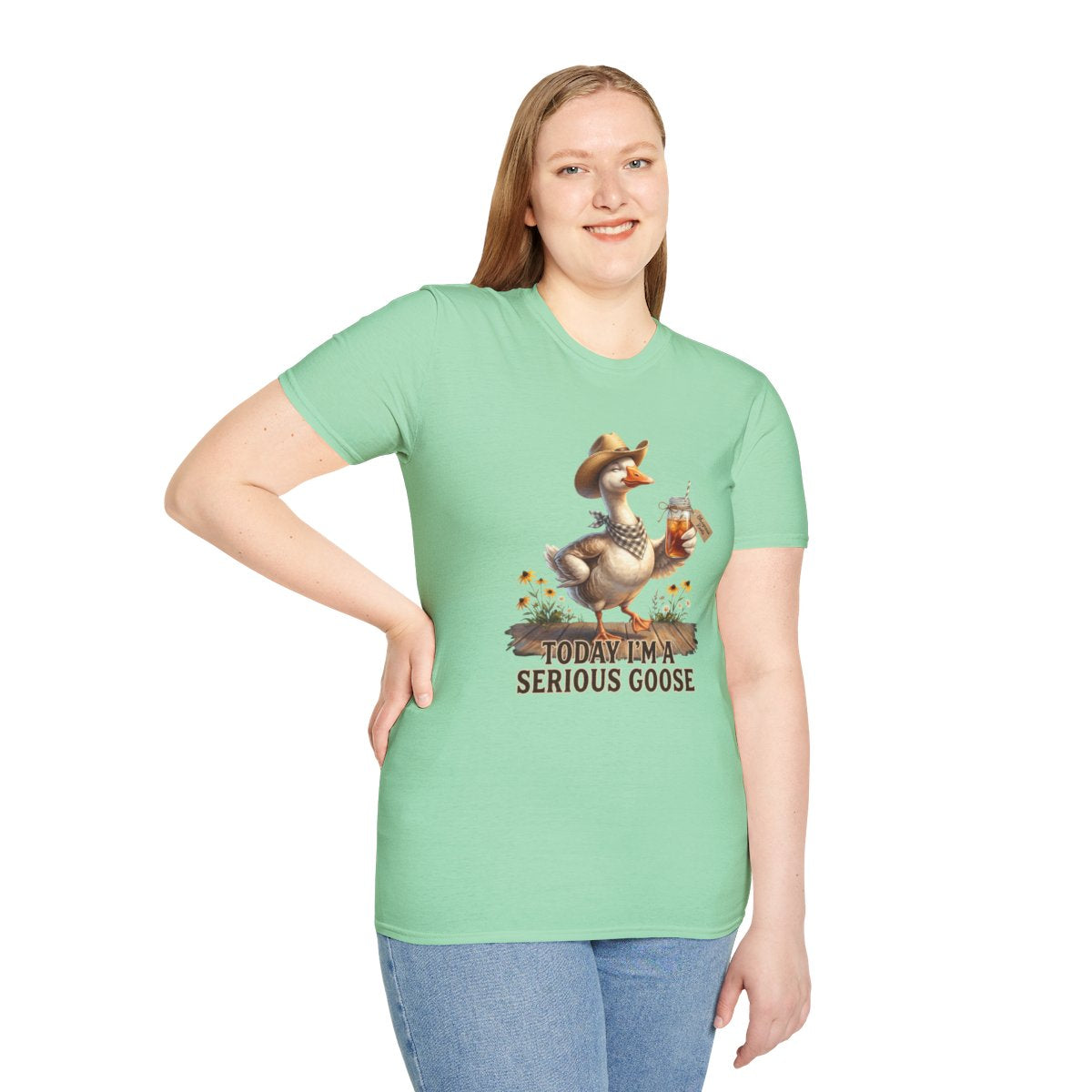 A woman with long blonde hair, smiling in a mint green Sweet Tea Shirt - Today I'm a Serious Goose tee, hand on hip