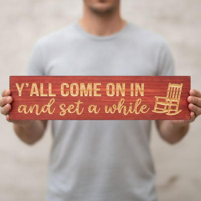 Wood Porch Sign — Y'all Come On In And Set A While — shown to scale, held — Bluegrass Gifts