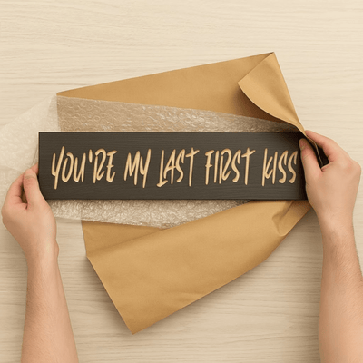 couple-holding-last-first-kiss-wood-sign-roma - youre my last first kiss wood sign by Bluegrass Gifts